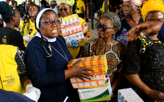Sr. Dr. Margaret Ogunkuade, a Sister of St. Michael the Archangel, distributes nutrients and medications during a community health outreach in Ketu, Nigeria. (Courtesy of Margaret Ogunkuade)
