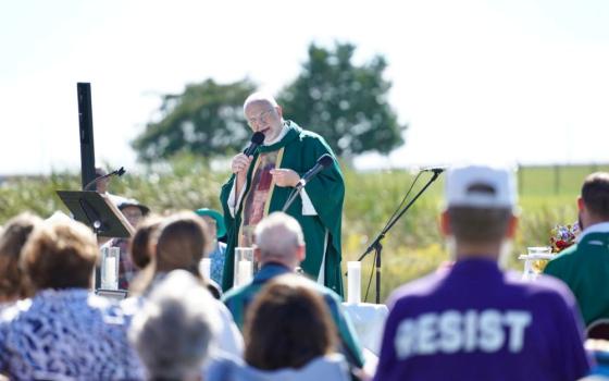Fr. Jim Farrell of the Archdiocese of Indianapolis delivers the homily at the Sept. 27 Mass at Miami Correctional, a facility that houses approximately 800 ICE detainees. About 450 people attended the Mass. (Courtesy of Allison Mayer)