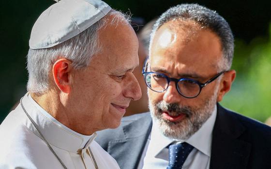 Pope Leo XIV talks with his personal physician, Luigi Carbone, as the pontiff arrives at Rome's Gemelli Hospital Oct. 13, 2026, ahead of his surgery that afternoon. (OSV News/Reuters/Guglielmo Mangiapane)