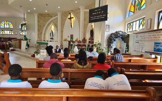 Sr. Mary Josephine Adhiambo Ogutu of the Franciscan Sisters of St. Ann interprets the homily in sign language for members of the deaf community during Holy Mass at Holy Trinity Catholic Church, Nakuru. (Mourine Achieng)