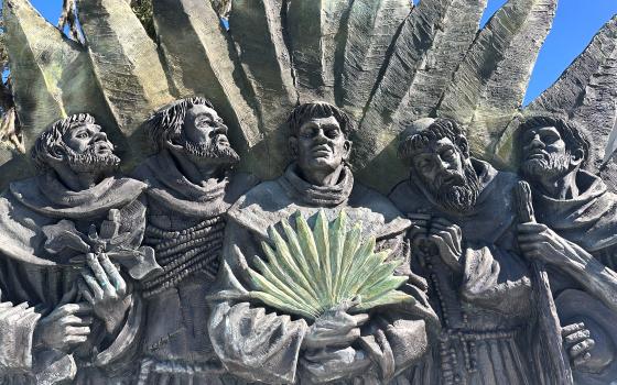 a sculpture, depicting five Spanish missionaries who were killed in 1597, stands outside the Nativity of Our Lady Catholic Church in Darien, Georgia