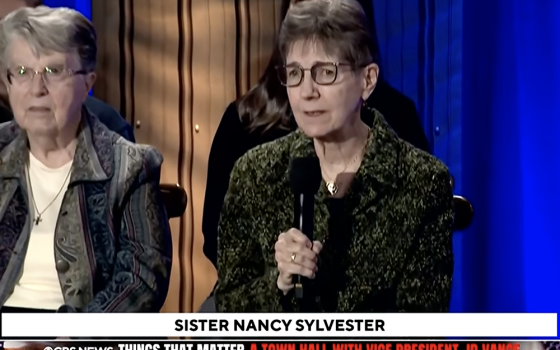 IHM Sr. Nancy Sylvester asks Vice President JD Vance a question about immigration enforcement at a town hall Oct. 17 in Detroit. (GSR screen capture)