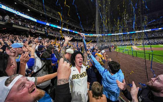 Fans cheer during a watch party at American Family Field after the Milwaukee Brewers defeated the Tampa Bay Rays in Game 5 of baseball's World Series, Wednesday, Oct. 28, 2026, in Milwaukee. (AP/Ross Harried)