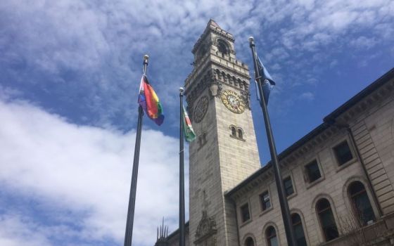 The progressive pride flag, at left, flies over city hall in Worcester, Massachusetts. (Courtesy of Guillermo Creamer Jr.)
