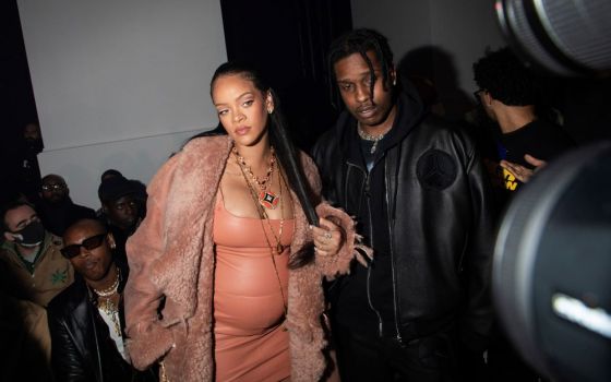 Rihanna, left, and ASAP Rocky arrive for the Off-White Ready To Wear Fall/Winter 2022-2023 fashion collection, unveiled during Fashion Week in Paris Feb. 28. Rihanna's pregnancy became public Jan. 31 with a photo of her baring her baby bump. (AP/Invision/