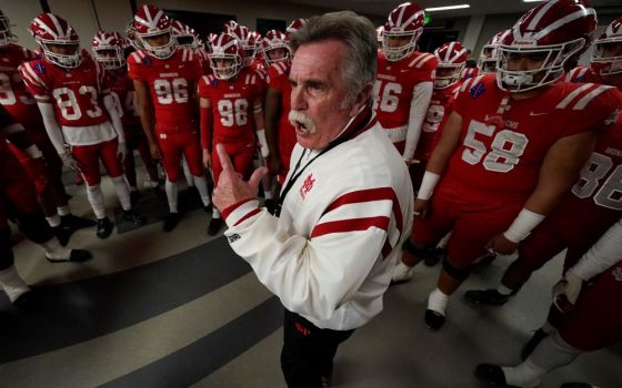 Mater Dei head coach Bruce Rollinson talks to his team before the 2021 CIF Open Division high school football state championship game Dec. 11, 2021, in Mission Viejo, Calif. The team won the state championship game 44-7. (AP/Ashley Landis)