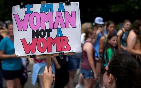 A demonstrator is seen near the Supreme Court in Washington, D.C., June 7. The court overruled the landmark 1973 Roe v. Wade abortion decision in its June 24 ruling in the Dobbs case.
