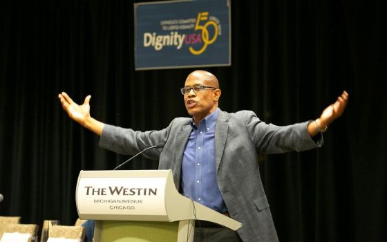 Theologian Fr. Bryan Massingale addresses the 2019 DignityUSA conference in Chicago. The group, which is holding its first in-person conference since 2019, has made some programming changes to make the event safer for participants. 