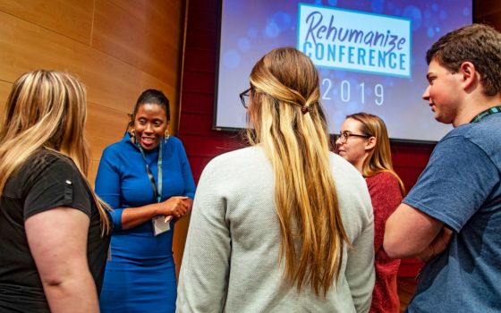 Louisiana State Rep. Katrina Jackson speaks with attendees at the Rehumanize Conference on the campus of Loyola University in New Orleans following a talk she gave on Oct. 19. (Grace Sommerville)
