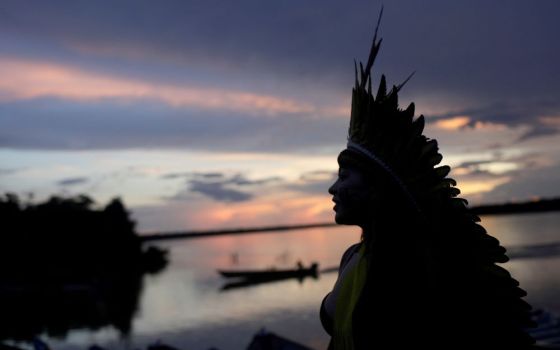 A leader of the Celia Xakriaba peoples walks along the banks of the Xingu River in Brazil's Xingu Indigenous Park Jan. 15, 2020. 