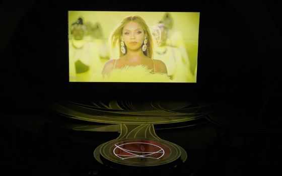 Beyonce appears on screen as she performs the song "Be Alive" from "King Richard" at the Oscars on March 27 at the Dolby Theatre in Los Angeles. (AP/Chris Pizzello)
