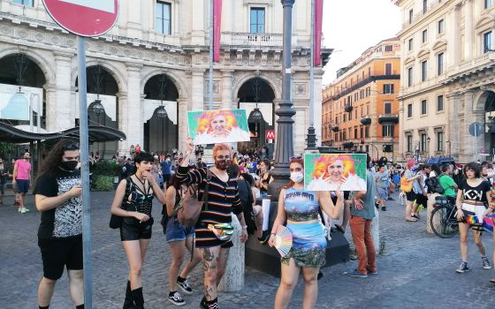 People gather with signs and bright clothing for the pride parade in Rome held last month. RNS photo by Claire Giangravè
