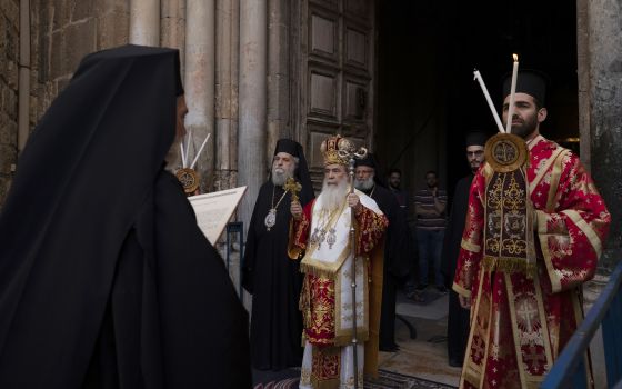 Greek Orthodox Patriarch of Jerusalem Theophilos III, center, walks in procession for the Washing of the Feet ceremony during the orthodox Holy Week at the Church of Holy Sepulchre, Thursday, April 29, 2021. (AP Photo/Maya Alleruzzo)