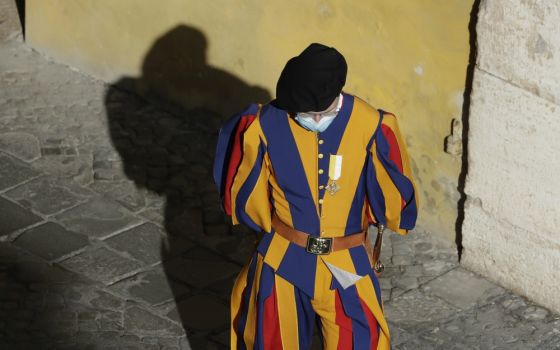 A Vatican Swiss Guard wears a face mask to prevent the spread of COVID-19 in the San Damaso courtyard ahead of Pope Francis' general audience Sept. 2 at the Vatican. (AP Photo/Andrew Medichini, file)