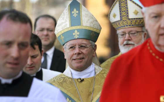 Bishop Peter Libasci, center, arrives at the Cathedral of St. Joseph for his installation service as bishop of the Diocese of Manchester, Dec. 8, 2011, in Manchester, New Hampshire. (AP file/Jim Cole)