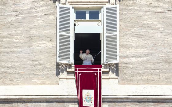 Pope Francis delivers his blessing as he recites the Angelus noon prayer from the window of his studio overlooking St.Peter's Square, at the Vatican, Sunday, Sept. 5, 2021. (AP Photo/Andrew Medichini)