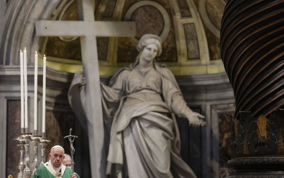 In this Oct. 10, 2021 file photo, Pope Francis holds the pastoral staff as he celebrates a mass in St. Peter's Basilica for the opening of the bishops' synod, at the Vatican. A European court ruled Tuesday, Oct. 12, 2021, that the Vatican couldn't be sued