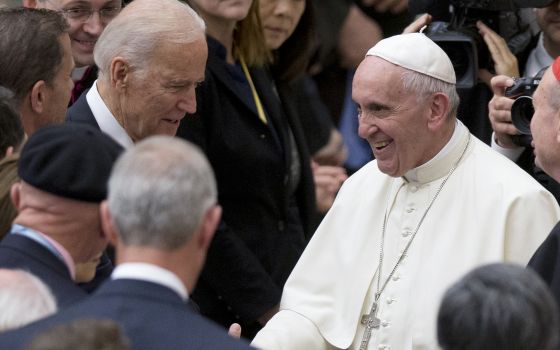 In this April 29, 2016, file photo Pope Francis shakes hands with Vice President Joe Biden as he takes part in a congress on the progress of regenerative medicine and its cultural impact, being held in the Pope Paul VI hall at the Vatican. (AP Photo/Andre