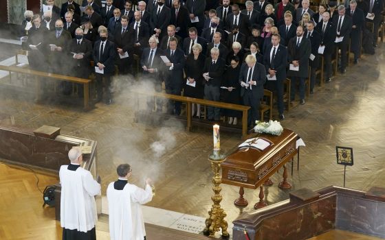 British Prime Minister Boris Johnson, right in front row, attends a Requiem Mass for slain member of parliament David Amess, inside Westminster Cathedral, central London, Tuesday, Nov. 23, 2021. (Stefan Rousseau/Pool Photo via AP)