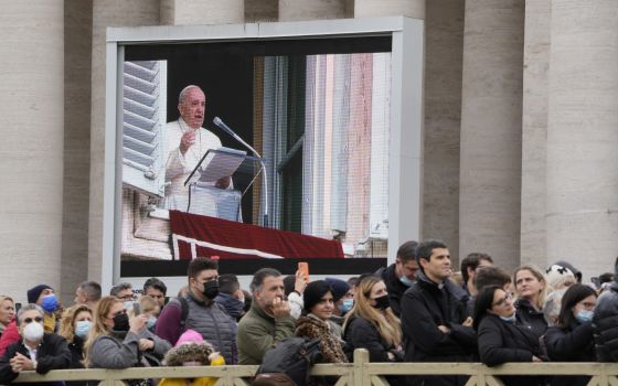 Faithful listen to Pope Francis' Angelus prayer in St. Peter's Square at the Vatican, Sunday, Nov. 28, 2021.(AP Photo/Gregorio Borgia)