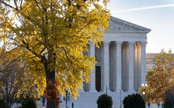 Light from the morning sun illuminates the Supreme Court in Washington, Friday, Dec. 3, 2021. (AP Photo/J. Scott Applewhite)