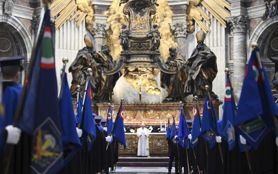 Pope Francis delivers his speech during an audience with members of the Italian Air Force, in St. Peter's Basilica at the Vatican, Friday, Dec. 10, 2021. (Vincenzo Pinto/Pool photo via AP)