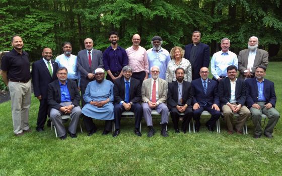 Participants pose for a photo during an interfaith meeting of the National Council of Churches and the US Council of Muslim Organizations (RNS/ Imam Naeem Baig)