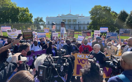 Rabbi David Saperstein, center right with microphone, speaks during a voting rights rally outside the White House on Tuesday, Oct. 19, 2021, in Washington. (RNS photo by Jack Jenkins)