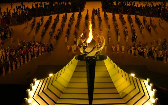 The Olympic flame burns July 23 during the opening ceremony in the Olympic Stadium at the 2020 Summer Olympics in Tokyo, Japan. (AP/Lee Jin-man)