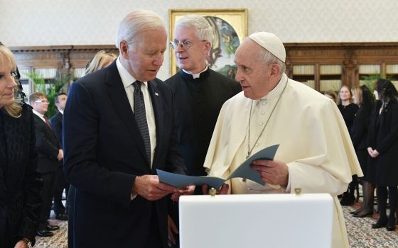 President Joe Biden, left, exchanges gifts with Pope Francis as they meet at the Vatican, Friday, Oct. 29, 2021. Photo by Vatican Media