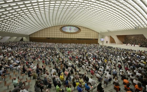 People listen to Pope Francis during his weekly general audience in Paul VI hall Sept. 8 at the Vatican. (AP/Andrew Medichini)