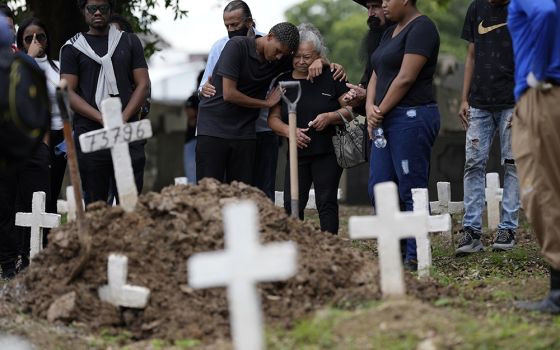 Gabrielle Ferreira da Cunha, 41, who was killed during a police raid in the Vila Cruzeiro favela, at Caju cemetery May 25 in Rio de Janeiro, Brazil. (AP photo/Silvia Izquierdo)