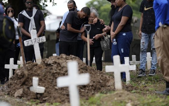 Gabrielle Ferreira da Cunha, 41, who was killed during a police raid in the Vila Cruzeiro favela, at Caju cemetery May 25 in Rio de Janeiro, Brazil. (AP photo/Silvia Izquierdo)