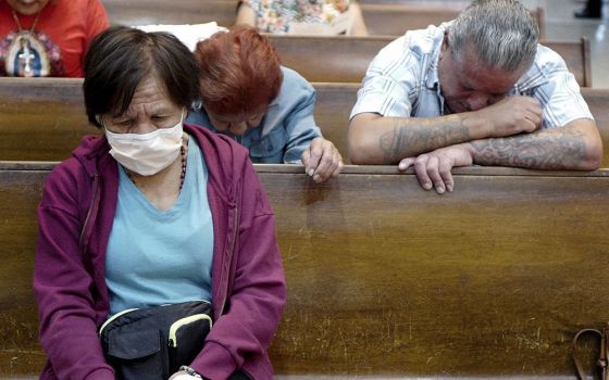 Esperanza Treviño, mother of Melissa Lucio, bows her head during a vigil at the Basilica of Our Lady of San Juan del Valle National Shrine April 22 in San Juan, Texas. On April 25, the Texas Court of Criminal Appeals stayed Lucio's execution.