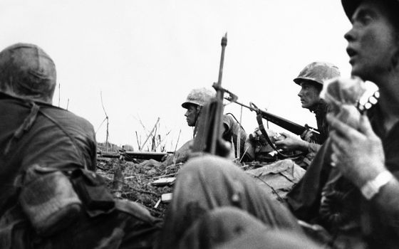 In a photo taken by French photojournalist Catherine Leroy, U.S. Marines get ready for a final assault on a hilltop in northwestern Vietnam on May 3, 1967. (AP/Catherine Leroy)
