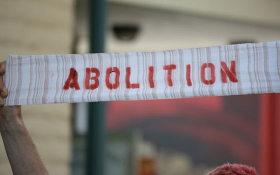 A call for abolition is seen in Santa Cruz, California, during a 2013 demonstration against prison overcrowding in the state. (Flickr/Richard Masoner)