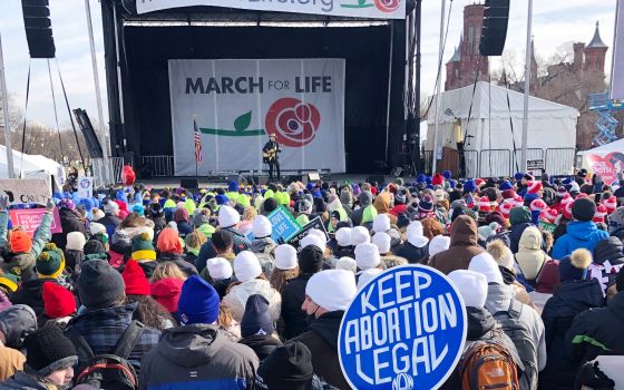 People attend the March for Life rally on the National Mall in Washington, Friday, Jan. 21, 2022. The March for Life, for decades an annual protest against abortion, arrives this year as the Supreme Court has indicated it will allow states to impose tight