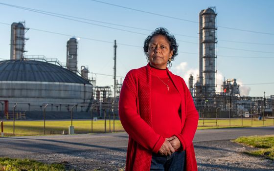 Rise St. James founder Sharon Lavigne stands in front of a chemical plant near her home in St. James Parish, Louisiana. (University of Notre Dame/Barbara Johnston)