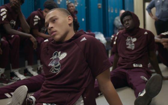St. Benedict's basketball players C.J. Wilcher, left, and Madani Diarra sit in the locker room pictured in "Benedict Men" (Quibi/Whistle Studios)