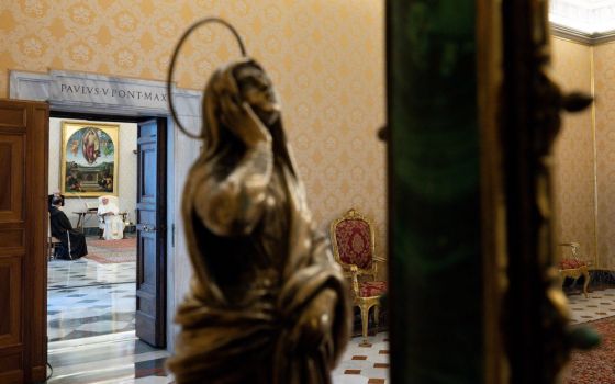 Pope Francis leads his general audience in the library of the Apostolic Palace at the Vatican Nov. 4. The weekly papal audience returned to being closed to the public as COVID-19 cases increase in Italy. (CNS/Vatican Media)