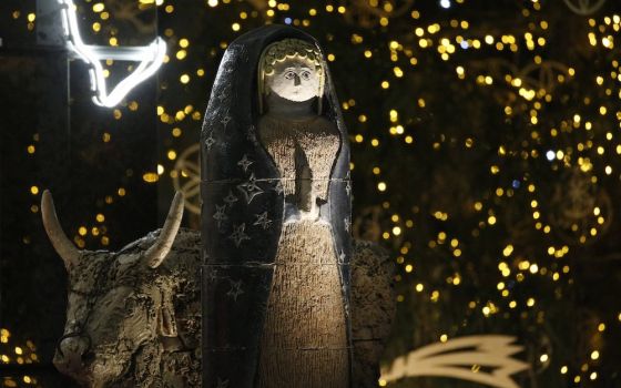 A figure of Mary is pictured in the Nativity scene in St. Peter's Square at the Vatican Dec. 14. The 52 ceramic statues were created by an arts high school in Castelli, Italy, between 1965 and 1975. (CNS/Paul Haring)