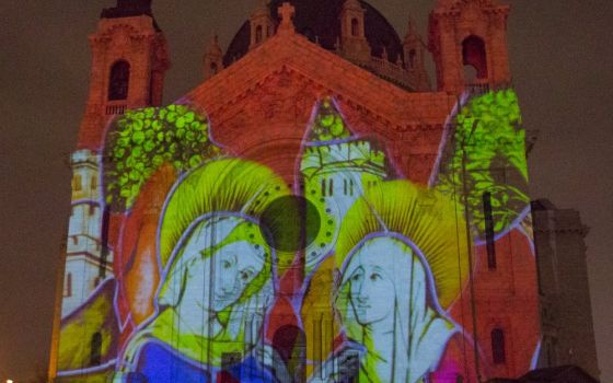 An image telling part of the Nativity story is reflected on the Cathedral of St. Paul in St. Paul, Minnesota, Dec. 17. (CNS/ The Catholic Spirit/Dave Hrbacek)