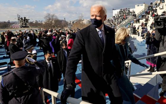 President Joe Biden leaves with first lady Jill Biden after his inauguration at the U.S. Capitol Jan. 20, 2021. (CNS/Reuters pool/Jonathan Ernst)