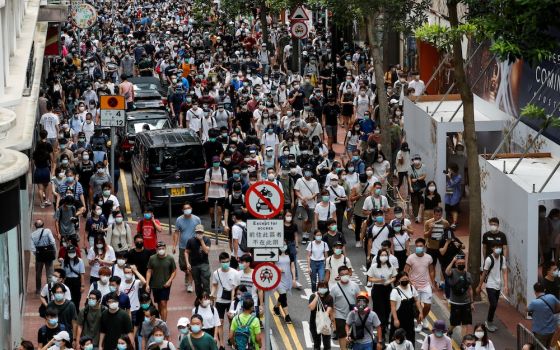 Demonstrators march during a protest against the national security law in Hong Kong July 1. (CNS/ Reuters/Tyrone Siu)