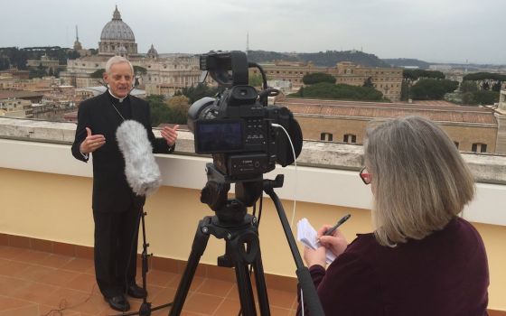 CNS Rome bureau chief Cindy Wooden interviews Cardinal Donald Wuerl of Washington, D.C., in Rome April 8, 2016. (CNS/Robert Duncan)