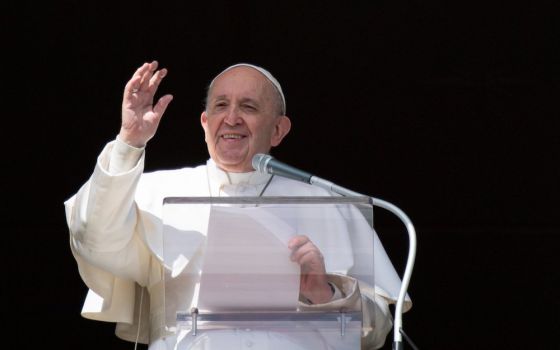 Pope Francis greets the crowd as he leads the Angelus from the window of his studio overlooking St. Peter's Square at the Vatican Feb. 28, 2021. (CNS/Vatican Media)