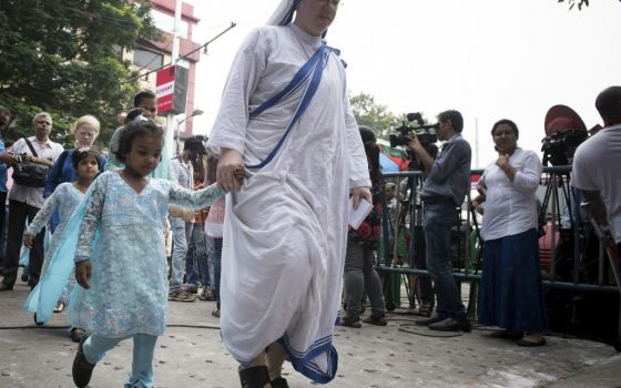 Missionaries of Charity Sister and a child
