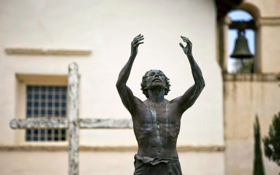 A statue of St. John the Baptist stands outside Old Mission San Juan Bautista in California. (CNS/Nancy Wiechec)