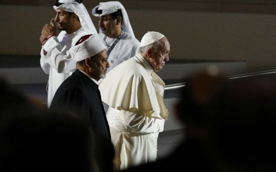 Sheik Ahmed el-Tayeb, grand imam of Egypt's al-Azhar mosque and university, and Pope Francis arrive for an interreligious meeting at the Founder's Memorial in Abu Dhabi, United Arab Emirates, Feb. 4. (CNS/Paul Haring)