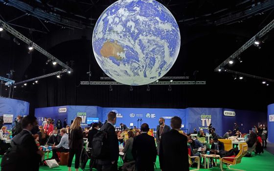 Some 20,000 delegates, and thousands more activists and advocates, are expected to attend the U.N. climate conference known as COP26, which began Oct. 31 in Glasgow, Scotland. Attendees are pictured at the summit Nov. 2. (EarthBeat photo/Brian Roewe)